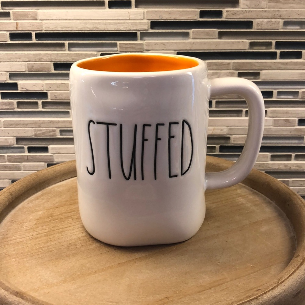 Rae Dunn “Stuffed” mug inside orange